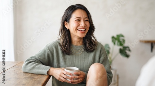 woman holding cup of coffee