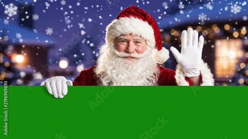 Christmas Banner template, Realistic Santa Claus Waving Hand Behind Blank Green Panel with Copy Space for Christmas Greeting Card