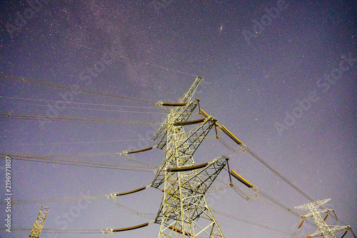 Bild auf Leinwand Power pylon starry sky electric tower