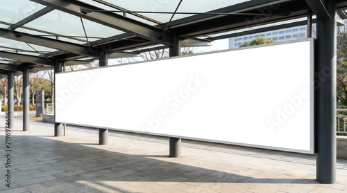 Edited visual for advertising billboard display at pedestrian walkway of MRT train station. Blank billboards of advertising space for mock up purpose; OOH ad placement