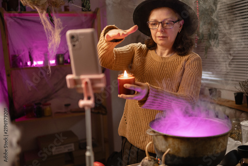 Foto realistic witch vlogger reviewing brewing potion in cauldron, broadcasting on social media