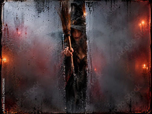 Halloween Witch with Broom Behind Foggy Glass Horror Background Copy Space Design