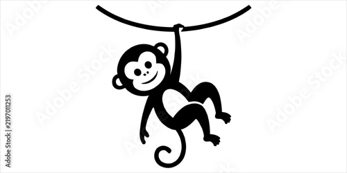 Photography A solid black silhouette of a cute monkey hanging from a horizontal tree branch