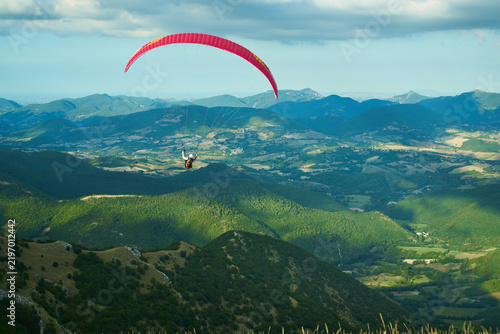 paraglider in the green mountains