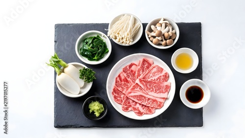 Raw beef slices with accompaniments