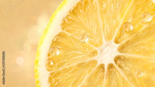 Closeup of a lemon slice with water droplets
