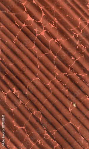 Historic hand-marbled book endpaper with diagonal brown texture (Wellenmarmorpapier)