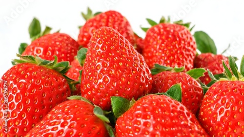 Fresh red strawberries with green leaves