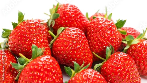 Fresh red strawberries with green leaves