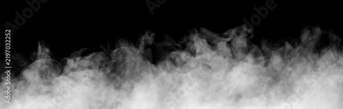 White smoke cloud rising across a black background, creating a dramatic atmospheric effect with dense vapor, soft texture, fog, haze, and flowing mist for creative design, overlays, visual effects.