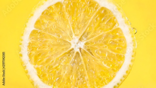 Sliced lemon with water droplets