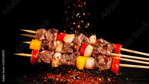 Grilled meat skewers with vegetables
