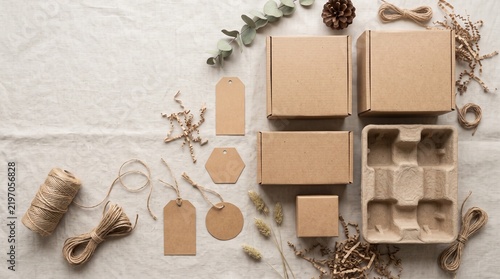 Eco-friendly packaging materials arranged as a premium flat lay with