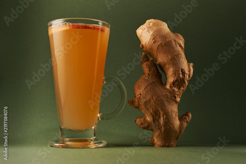 Hot Apple Ginger Cider in Glass Mug with Fresh Ginger Root