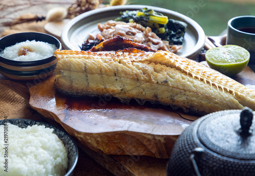 Charcoal-grilled Shima Hokke served with lime, refreshing grated daikon, and traditional sides. Golden, crispy skin gives way to tender ivory flesh, perfectly complemented by a bowl of steamed white