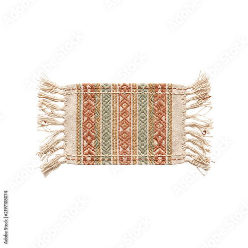 Handmade Woven Fringed Cotton Coaster Mug Rug Isolated Featuring a Bohemian Ethnic Geometric Pattern in Earthy Terracotta and Sage Green Tones