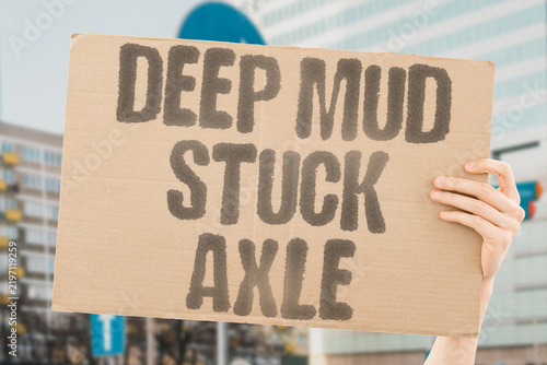 Fotografie "Deep mud stuck axle" Vehicle sinking soft ground