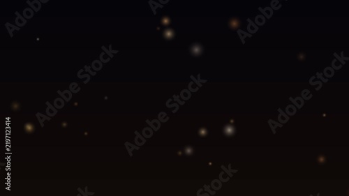 Glowing golden particles drift slowly against a deep black background, creating a soft and magical atmosphere.