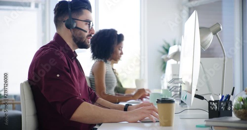 Computer, coworking and man with team in call center for contact us, consulting and faq support. Talking, office and workers on tech for customer service, telecommunication and virtual assistance