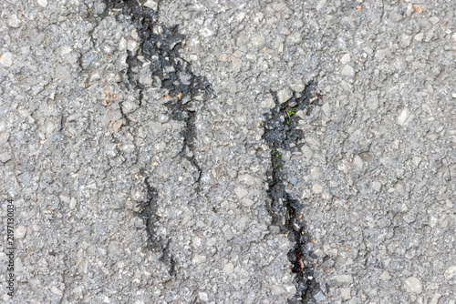 Obraz na plátně Cracked asphalt road surface showing damage and decay