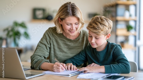 Mother Assisting Son With School Homework on Table at Home