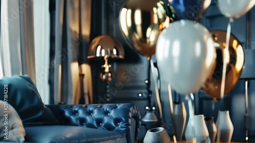 Elegant balloons floating in luxurious living room with leather chesterfield sofa. Party celebration decor in stylish interior
