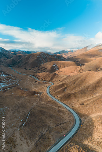Aerial view of road between the mountain in Lindis Pass, New Zealand.
