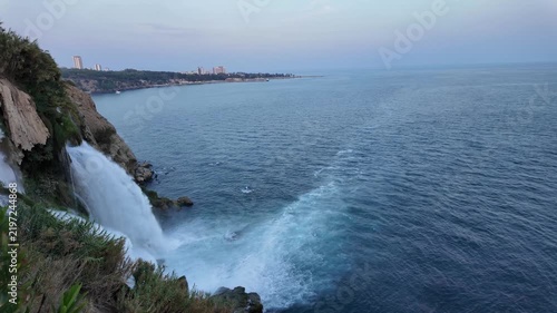 Slow motion view of Duden Waterfall cascading from Antalya cliffs into the Mediterranean Sea in Turkey