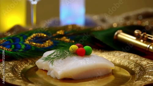 Cold Smoked Halibut with Peacock Feather and Flute for Krishna Janmashtami Celebration, Bokeh Background for Indian Culture, Govardhan Puja, Religious Symbolism, Festive Decor See Less