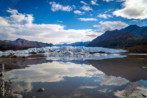 Matanuska Glacier reflected in calm glacial water, Alaska
