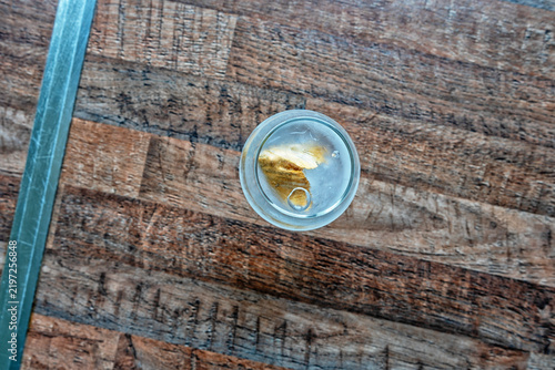 Night butterfly in a glass with ice
