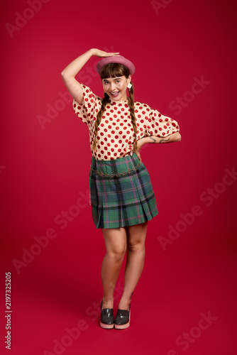 Bild auf Leinwand Cheerful woman radiates joy in vibrant colorful clothing and bold style