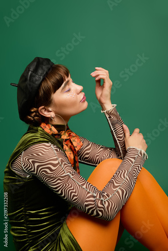 фотографія Cheerful woman embraces vibrant fashion with bold colors and stylish flair
