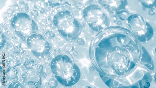 Clear Glass Bubbles on a Shiny Surface Reflect Light in a Bright Setting