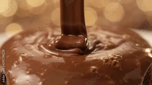 Melted Liquid Chocolate Pouring in Slow Motion, Warm Golden Bokeh Background, Delicious Dessert Confectionery Motion, 4K