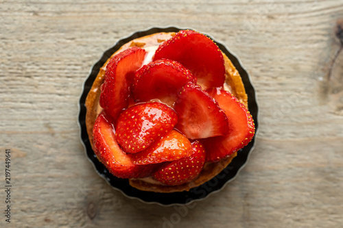 Strawberry Tart with Glazed Fruit on Rustic Wooden Table