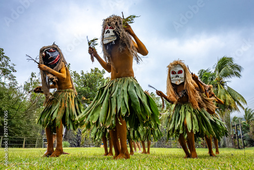 Masked performer wearing a distinctive natural fiber costume during a cultural performance in Rabaul, Papua New Guinea. Travel photography documenting traditional cultural expression.