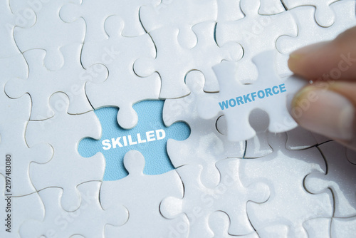 Piece of jigsaw puzzle skilled workforce phrase. For hiring talent and human resources