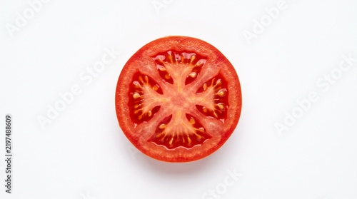 Single fresh tomato slice isolated on a clean white background