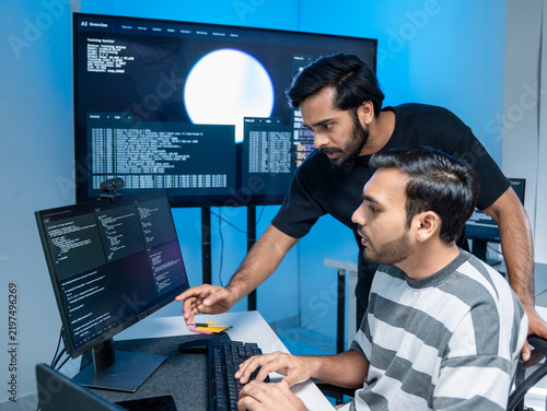 Software engineering use computer working develop AI office are assisting algorithm systems or verifying code. Programmer teamwork using artificial intelligence on laptop analysis or writing coding