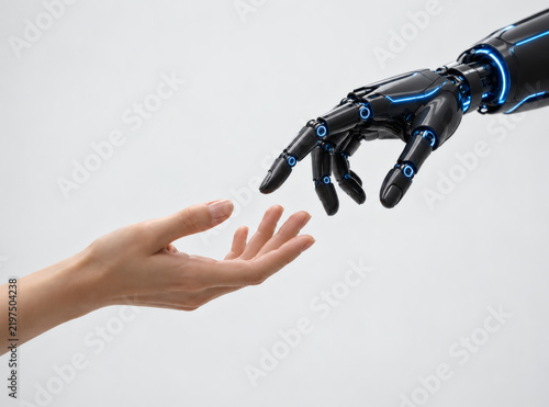 Human Hand Reaching Toward Black Robot Hand Almost Touching