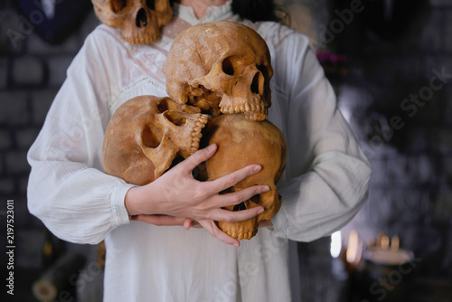 Fotografie Serene figure in white gently cradles ancient ancestral memories amid eerie atmo