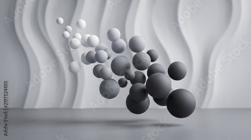 Abstract composition of floating spheres with varying shades of gray, creating a dynamic 3d depth effect against a wavy textured background