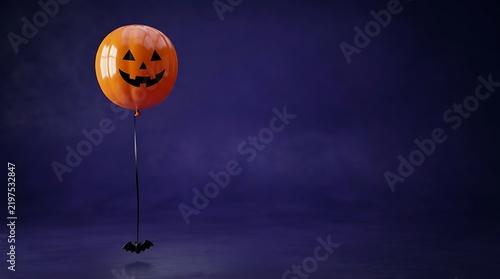 A single orange pumpkin balloon with a spooky face floating against a dark purple halloween background