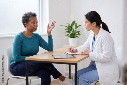 Patient Asking Questions During Consultation With Female Healthcare Professional