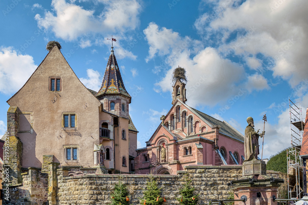 Obraz premium The Church of St. Peter and St. Paul is the church of the pretty village of Eguisheim. It is located in the historic center.. France