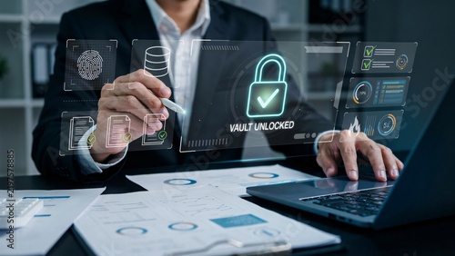 Businessman accessing secure digital vault on laptop with advanced cyber security interface