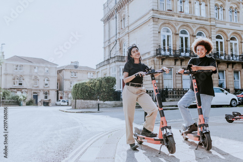 Photography Friends on electric scooters, city sightseeing eco-friendly style