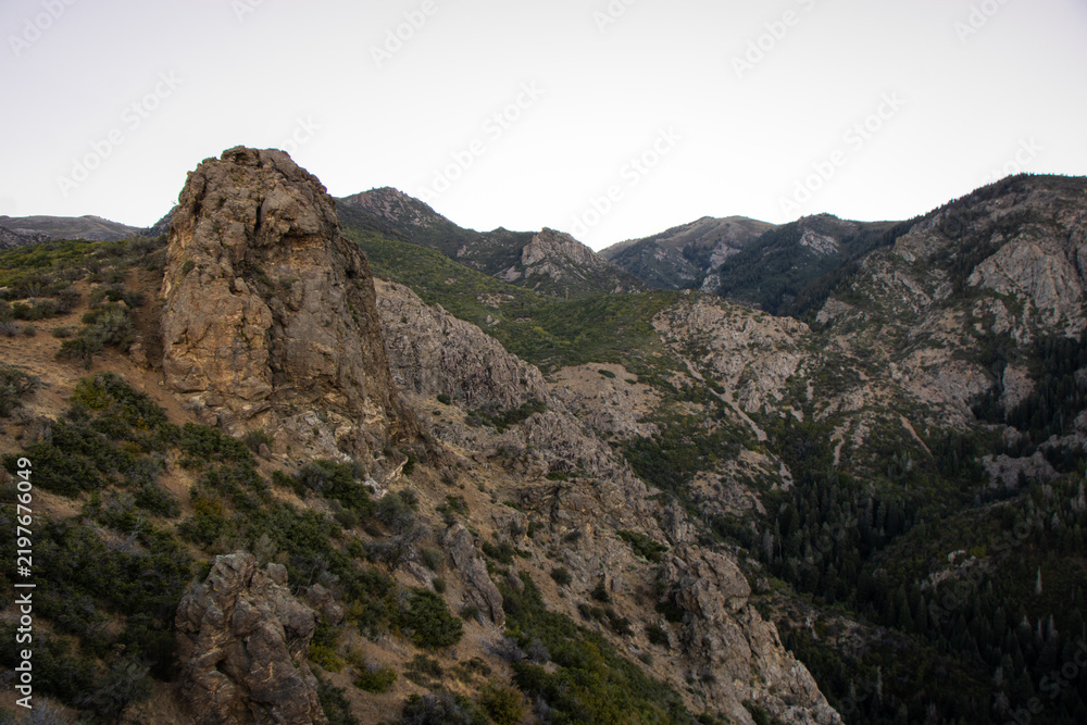 Fototapeta premium Rocky Trail Overlook Above Adams Canyon Looking Out Toward the Great Salt Lake and Layton Utah in Late Summer