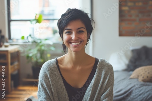 Happy Young Woman Smiling Indoors in a Cozy Apartment